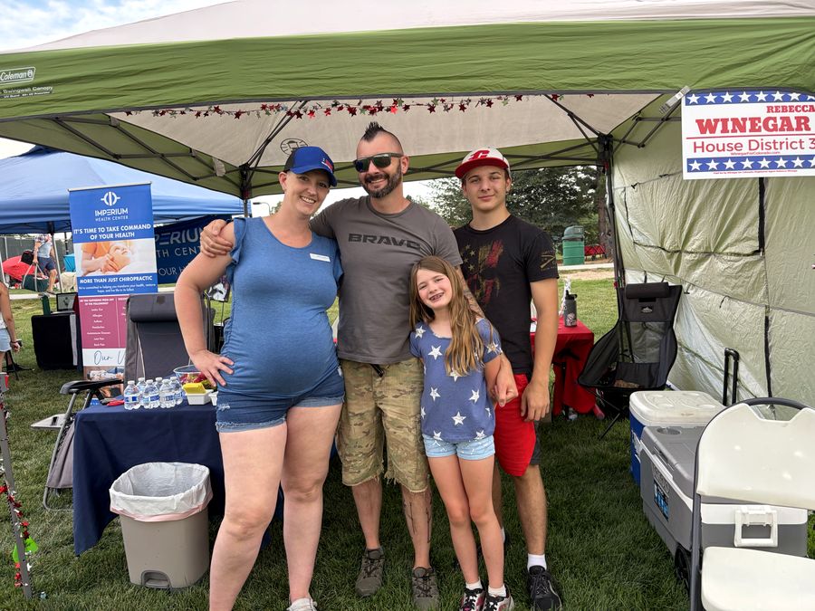 Rebecca Winegar with her family at the campaign booth during the Englewood Independence Day celebration, July 4, 2026